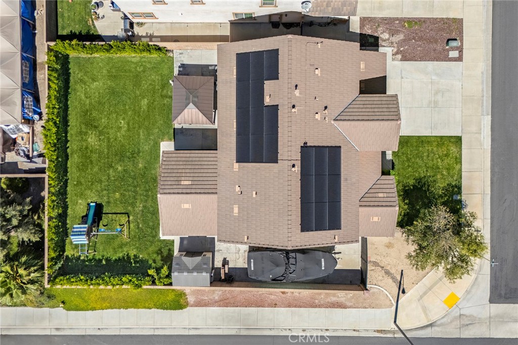 7357 Max Way Eastvale, CA 92880 - Photo 39 of 39 an aerial view of a house with a yard and potted plants
