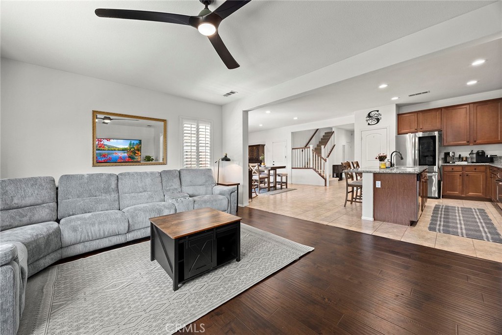 7357 Max Way Eastvale, CA 92880 - Photo 6 of 39 a living room with furniture and a view of kitchen