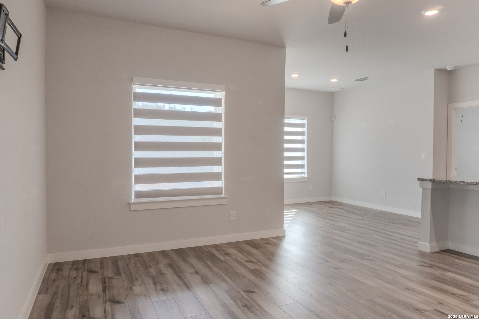 175 Ryan Crossing San Antonio, TX 78253 - Photo 14 of 37 an empty room with wooden floor and windows