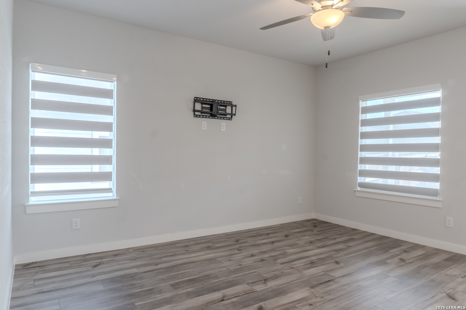 175 Ryan Crossing San Antonio, TX 78253 - Photo 15 of 37 wooden floor in an empty room with a window