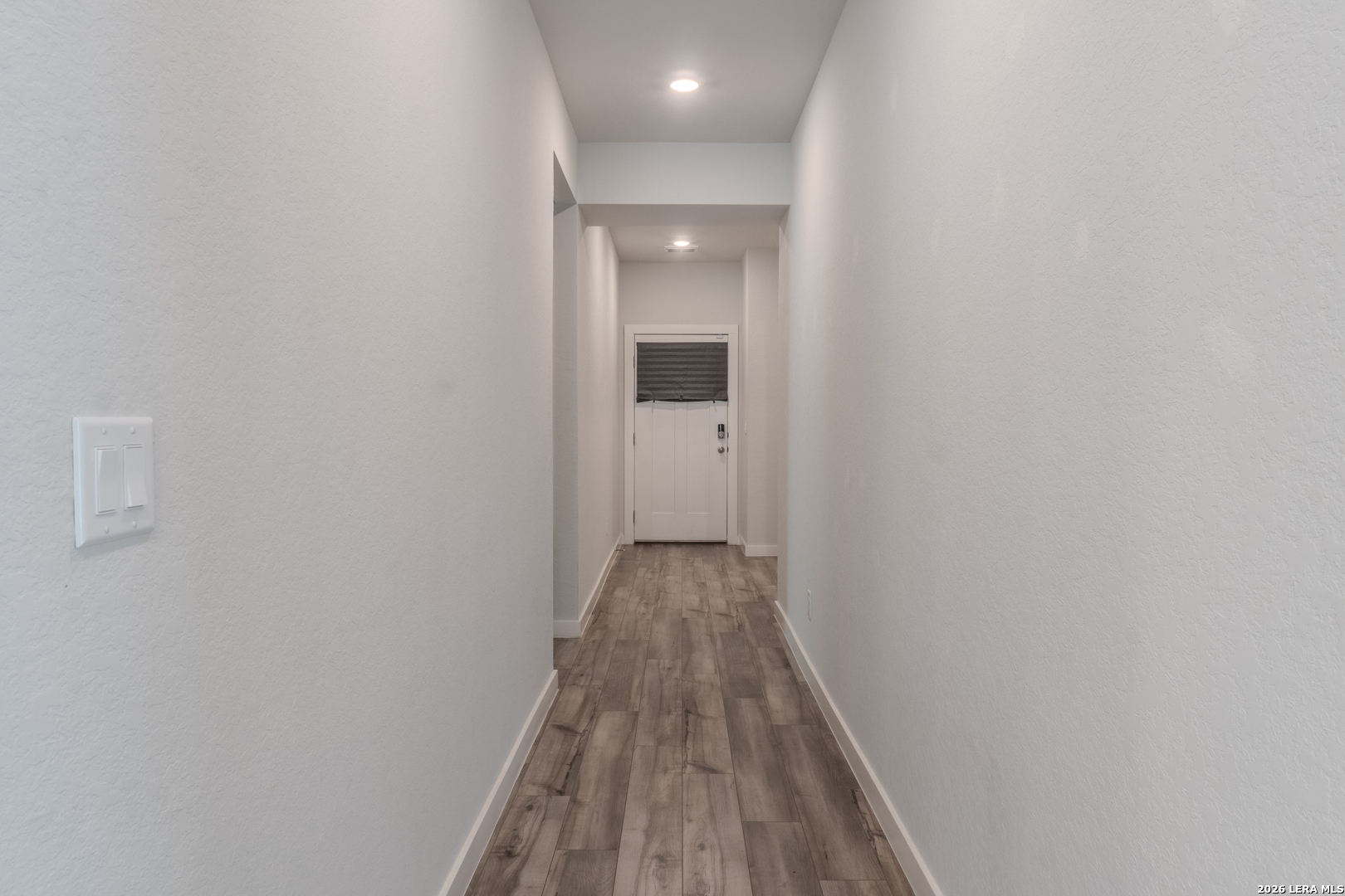 175 Ryan Crossing San Antonio, TX 78253 - Photo 5 of 37 a view of a hallway with wooden floor