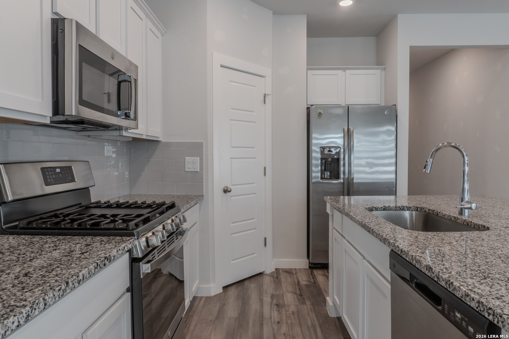 175 Ryan Crossing San Antonio, TX 78253 - Photo 10 of 37 a kitchen with stainless steel appliances granite countertop a sink stove and refrigerator