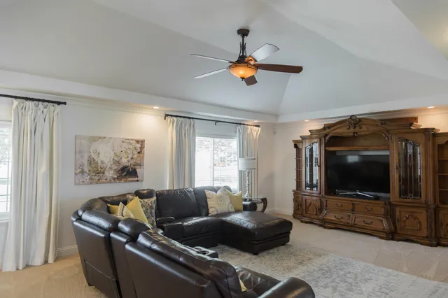 a kitchen with white cabinets and sink