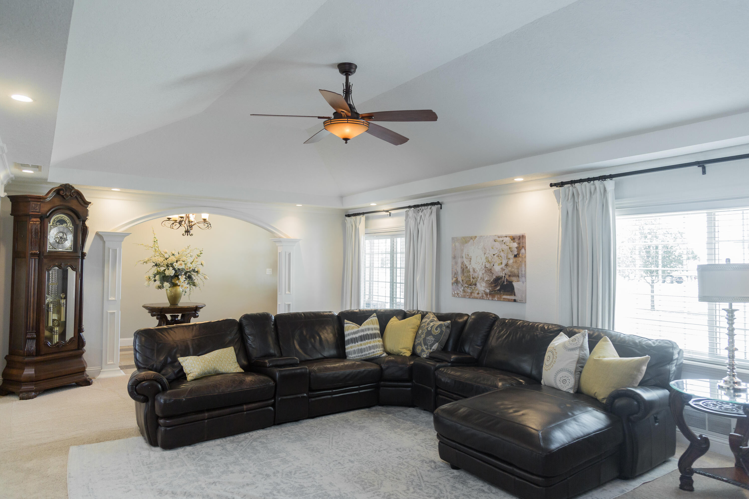 1308 West 24th Street Plainview, TX 79072 - Photo 14 of 85 a living room with furniture a ceiling fan and a large window