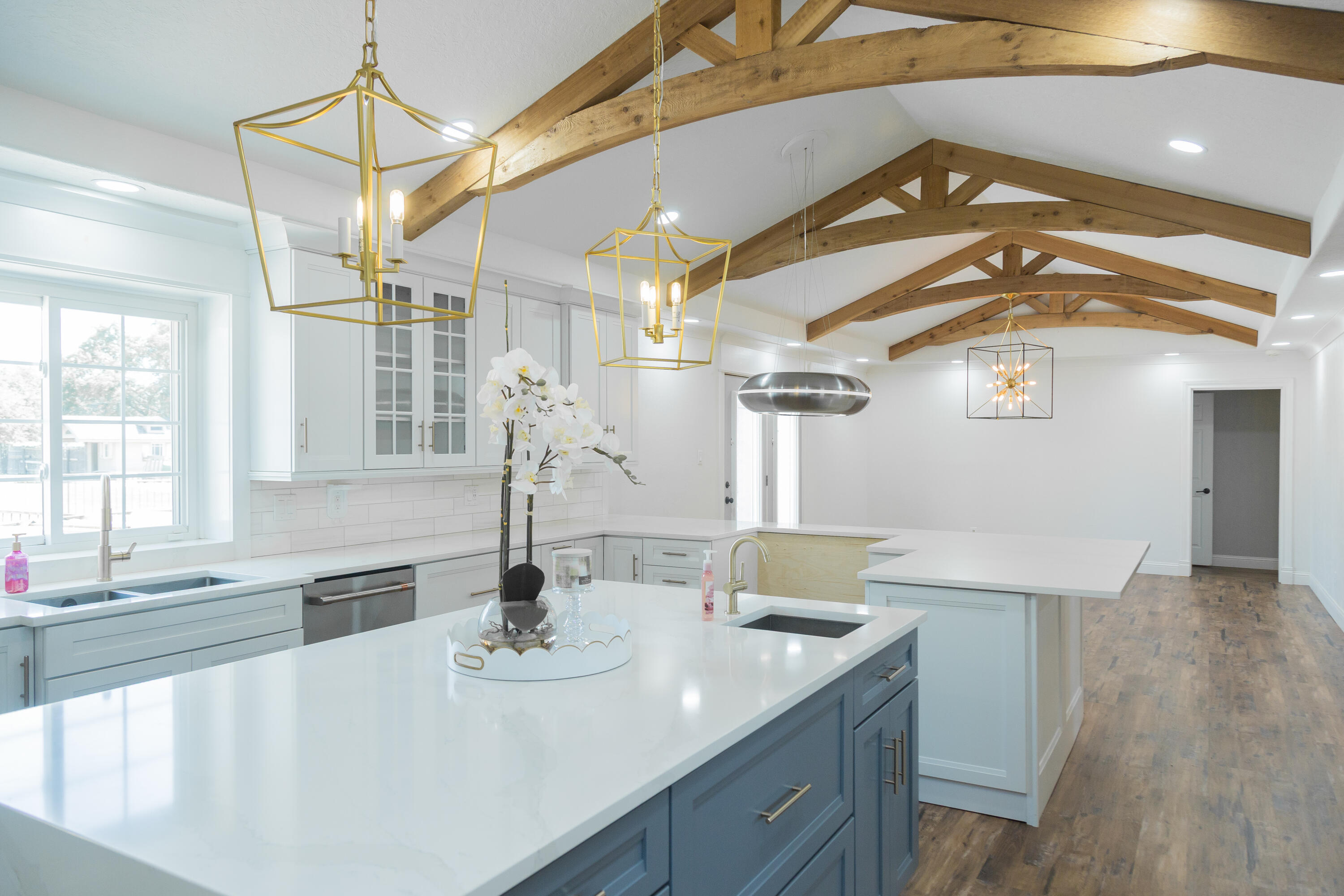 1308 West 24th Street Plainview, TX 79072 - Photo 23 of 85 a kitchen with a sink and a refrigerator