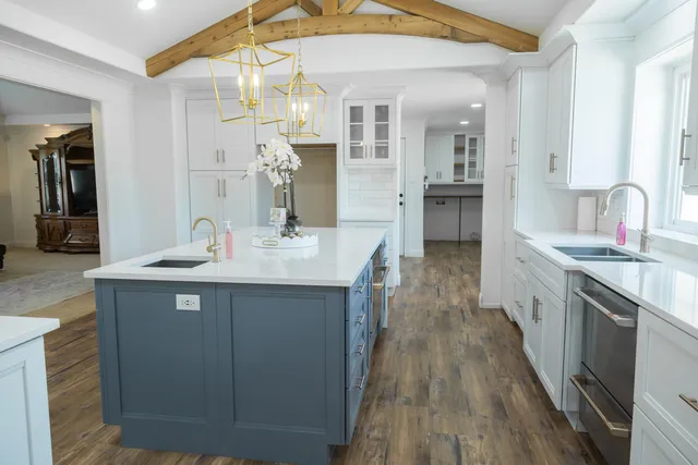 a bathroom with a tub sink and mirror