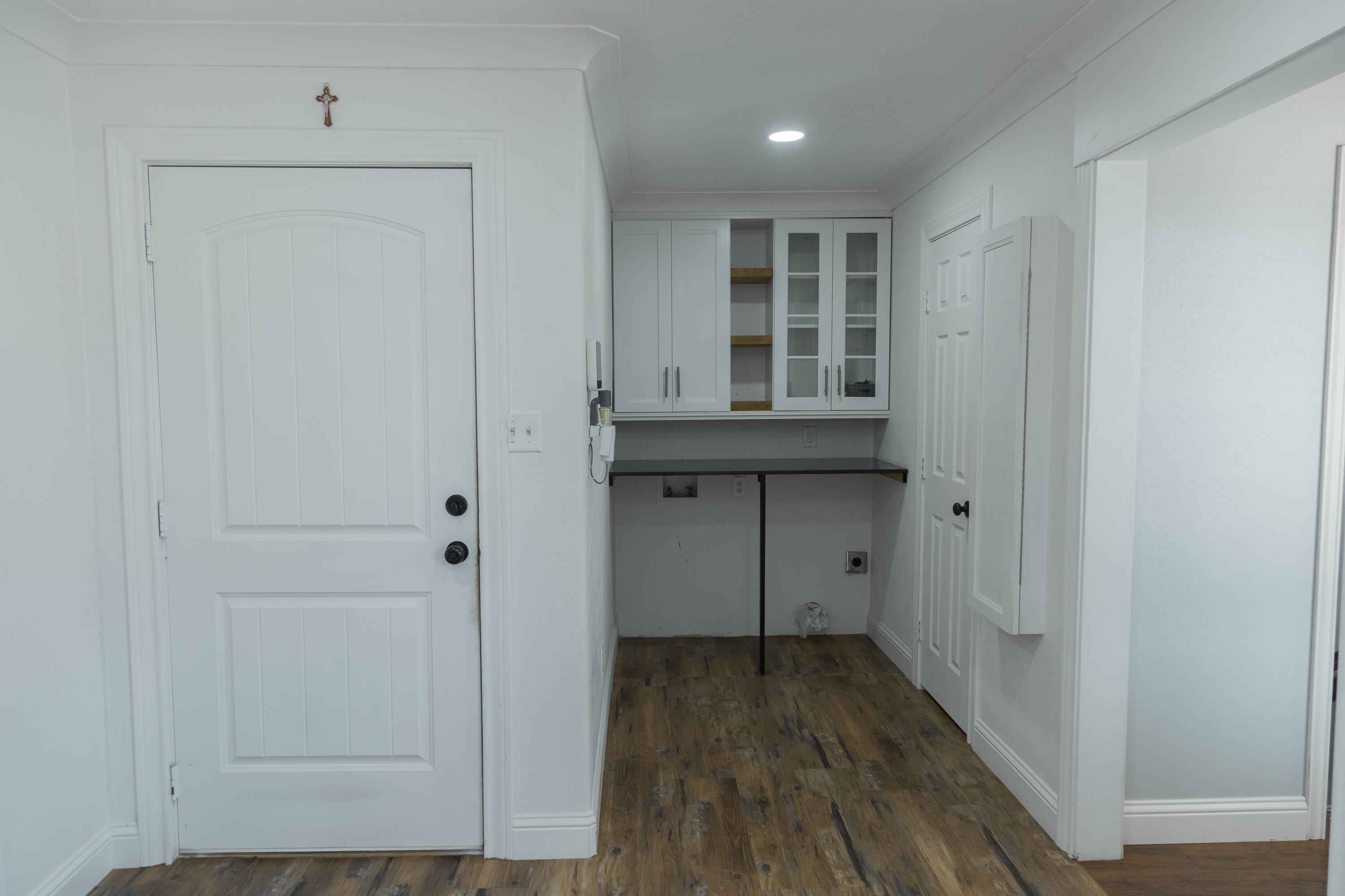 1308 West 24th Street Plainview, TX 79072 - Photo 30 of 85 a view of kitchen with wooden floor and cabinets