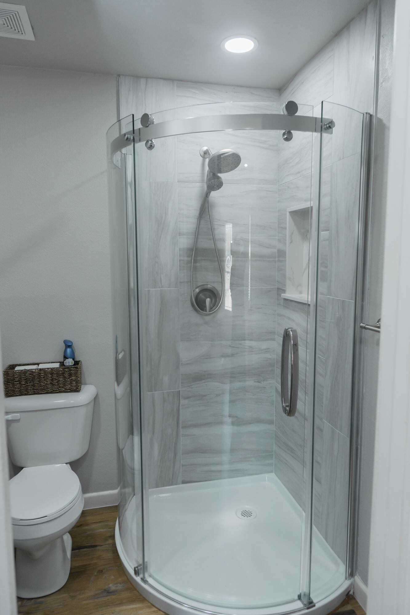 1308 West 24th Street Plainview, TX 79072 - Photo 33 of 85 a bathroom with a shower a toilet and a sink