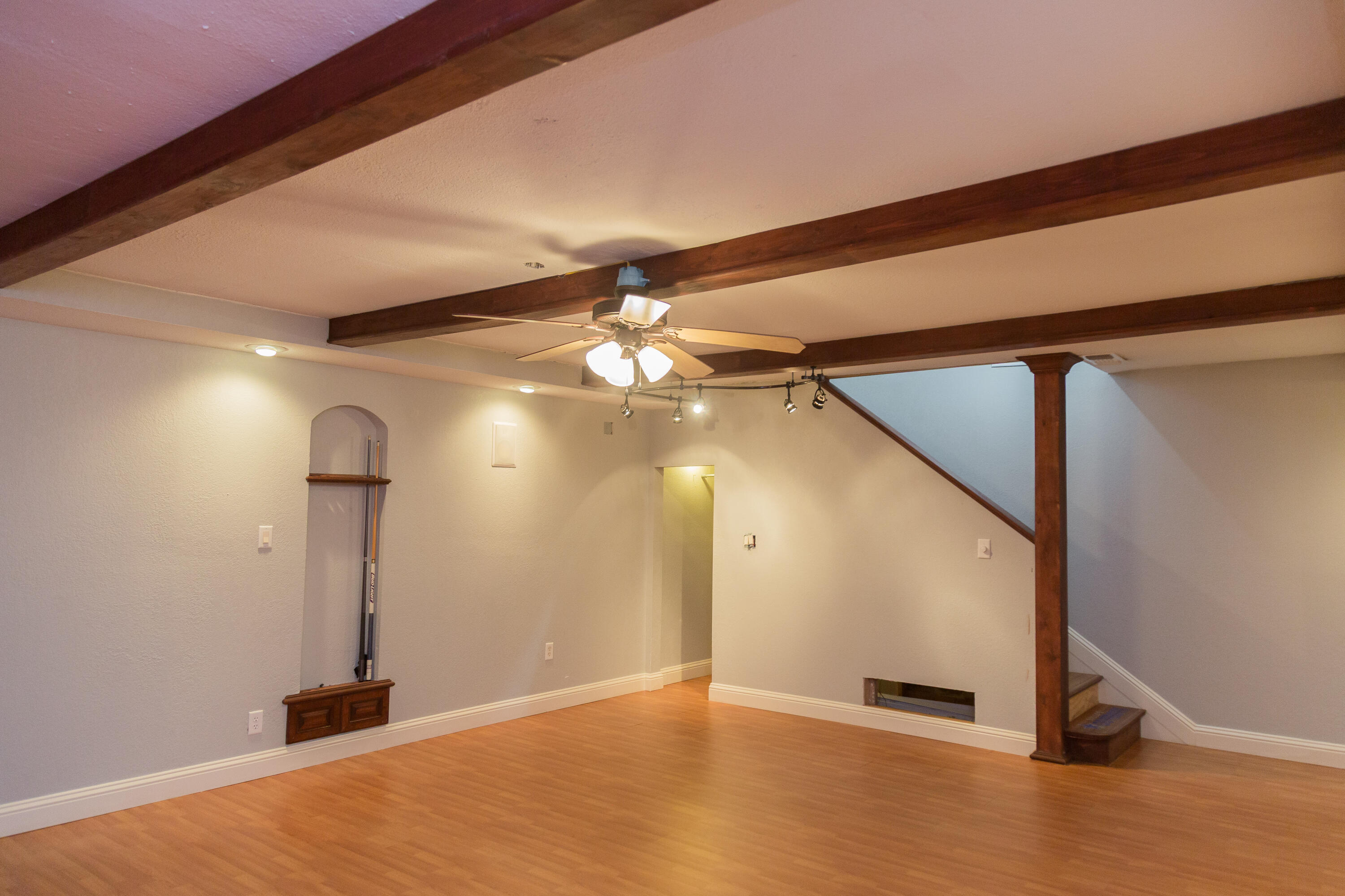 1308 West 24th Street Plainview, TX 79072 - Photo 39 of 85 a view of a room with gym equipment and a chandelier