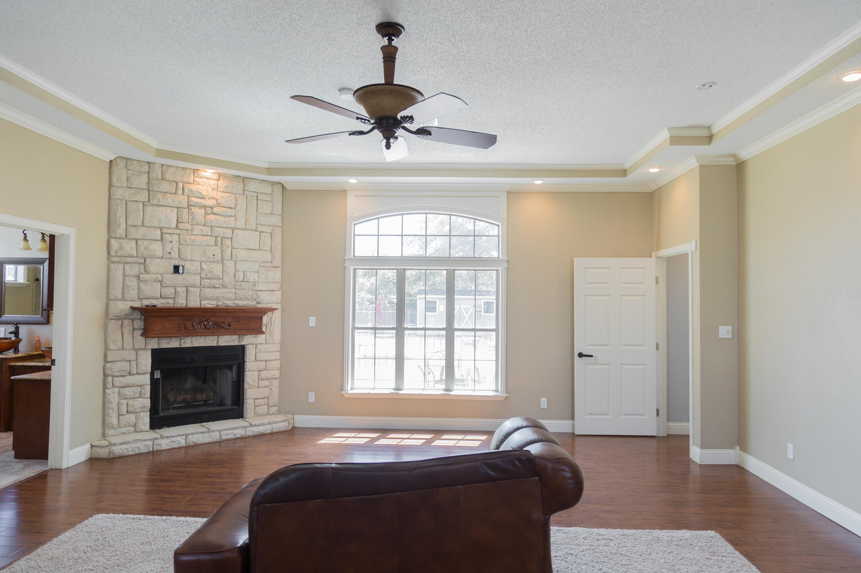 1308 West 24th Street Plainview, TX 79072 - Photo 43 of 85 a bedroom with a bed and a fireplace