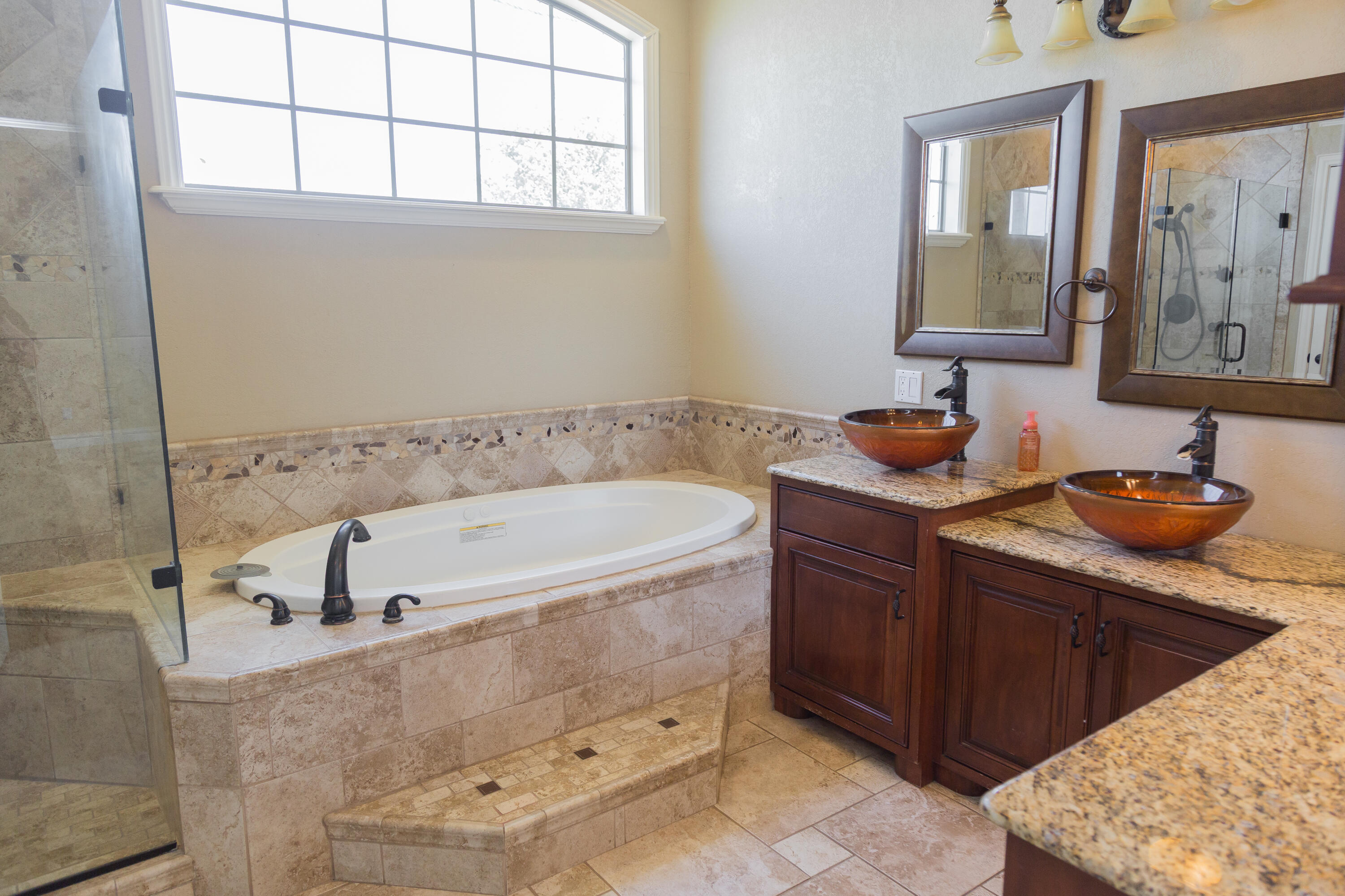 1308 West 24th Street Plainview, TX 79072 - Photo 46 of 85 a bathroom with a tub sink and mirror