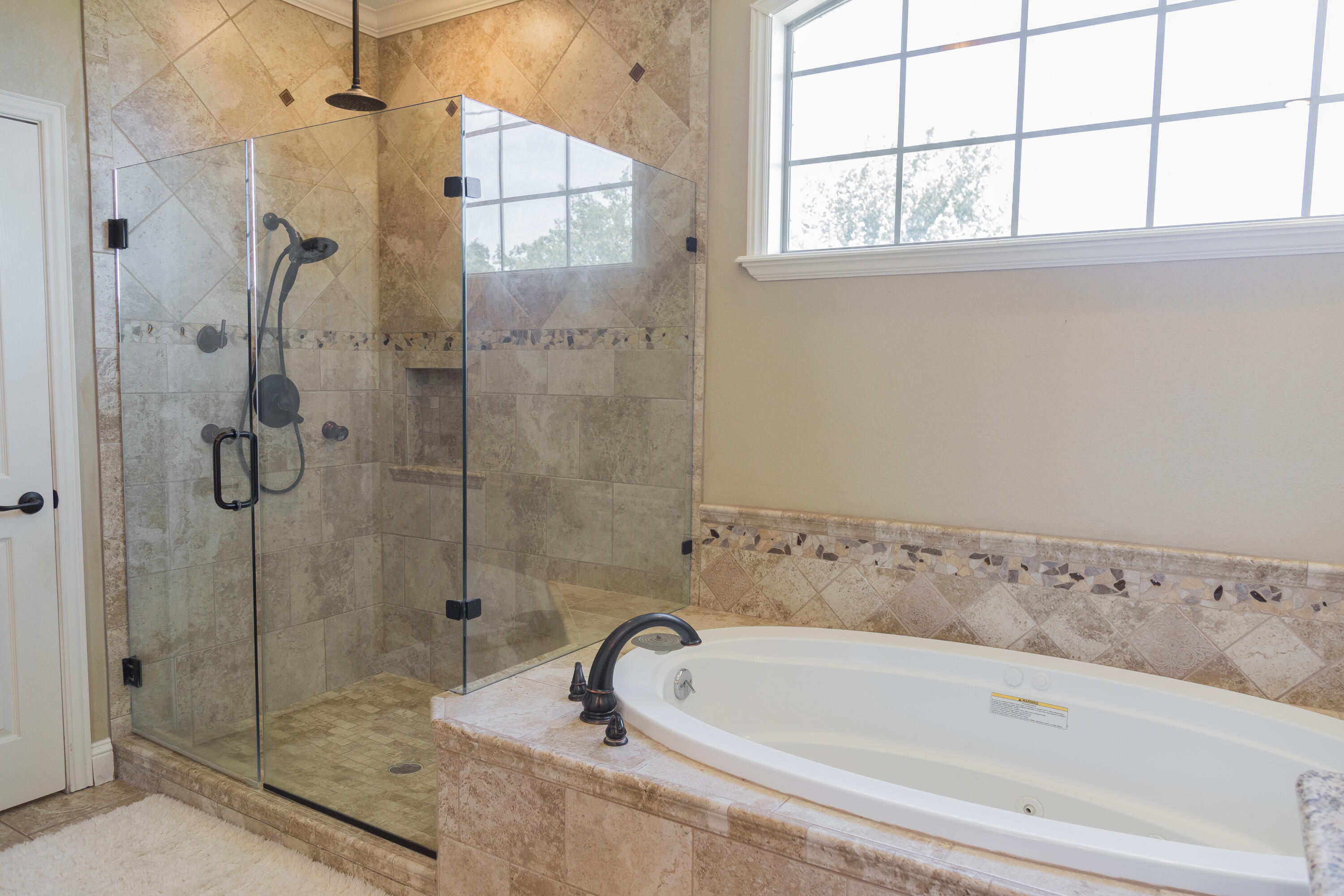 1308 West 24th Street Plainview, TX 79072 - Photo 48 of 85 a bathroom with a bathtub and shower