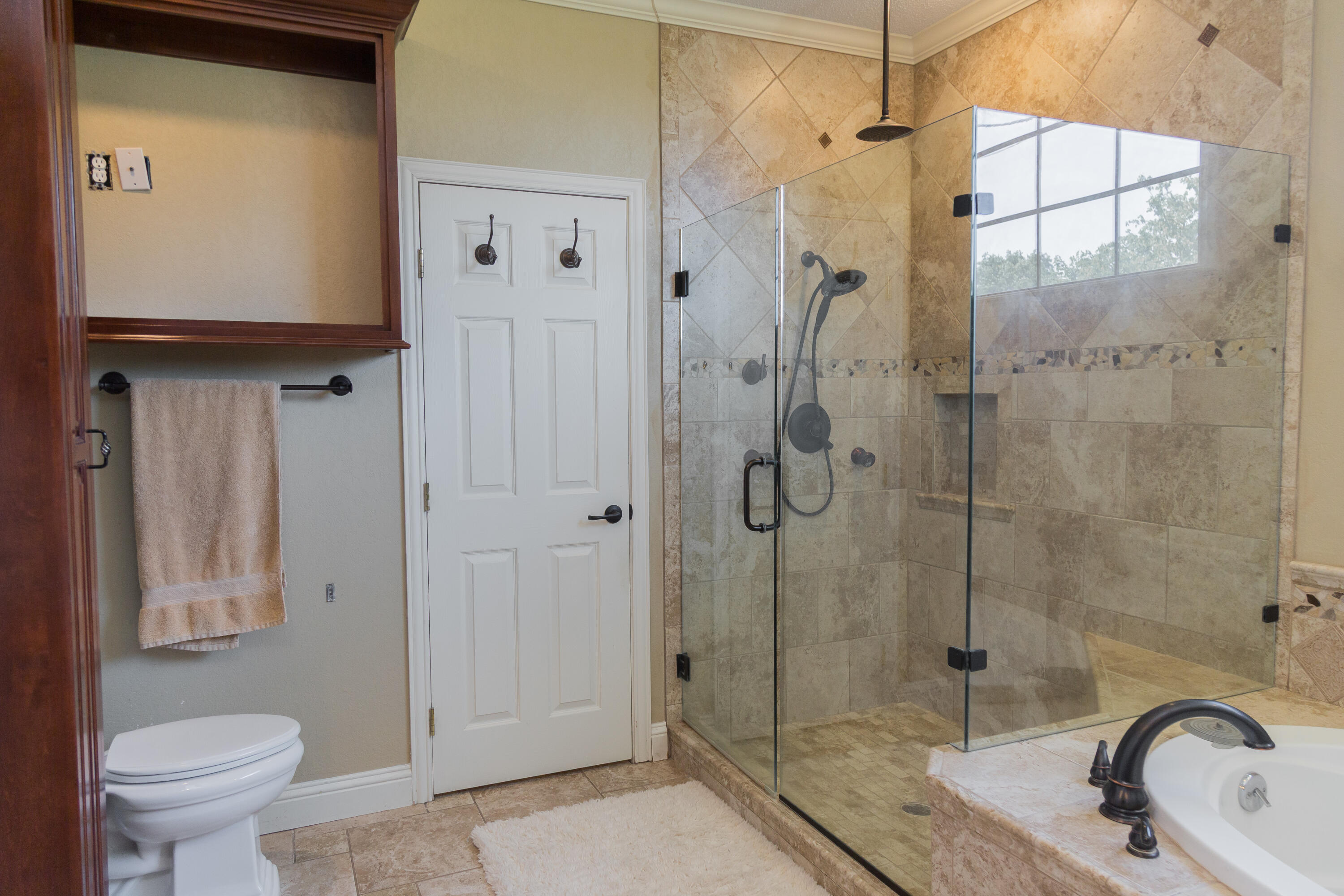 1308 West 24th Street Plainview, TX 79072 - Photo 49 of 85 a bathroom with a granite countertop sink toilet and shower