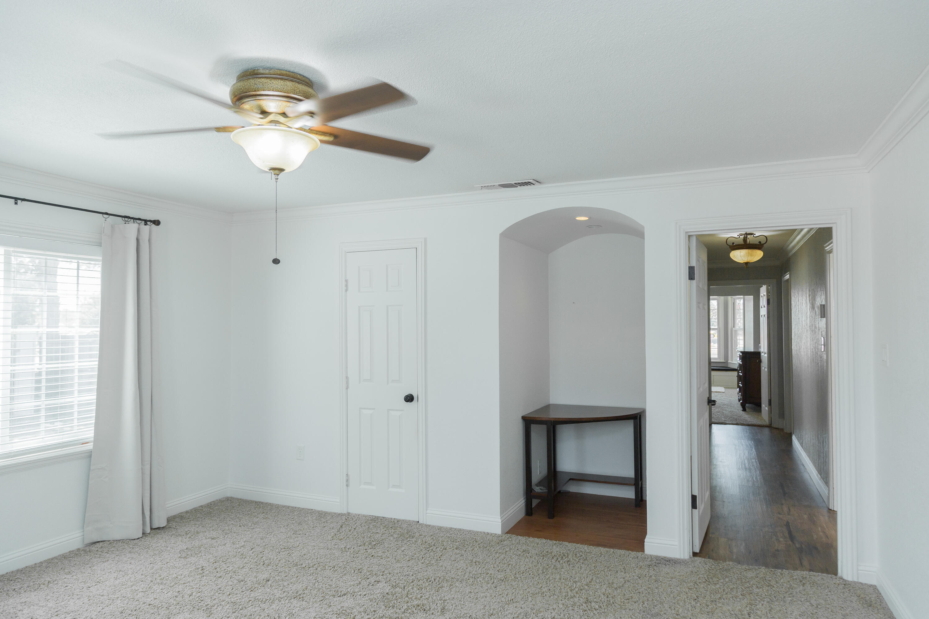 1308 West 24th Street Plainview, TX 79072 - Photo 57 of 85 wooden floor in an empty room with a window