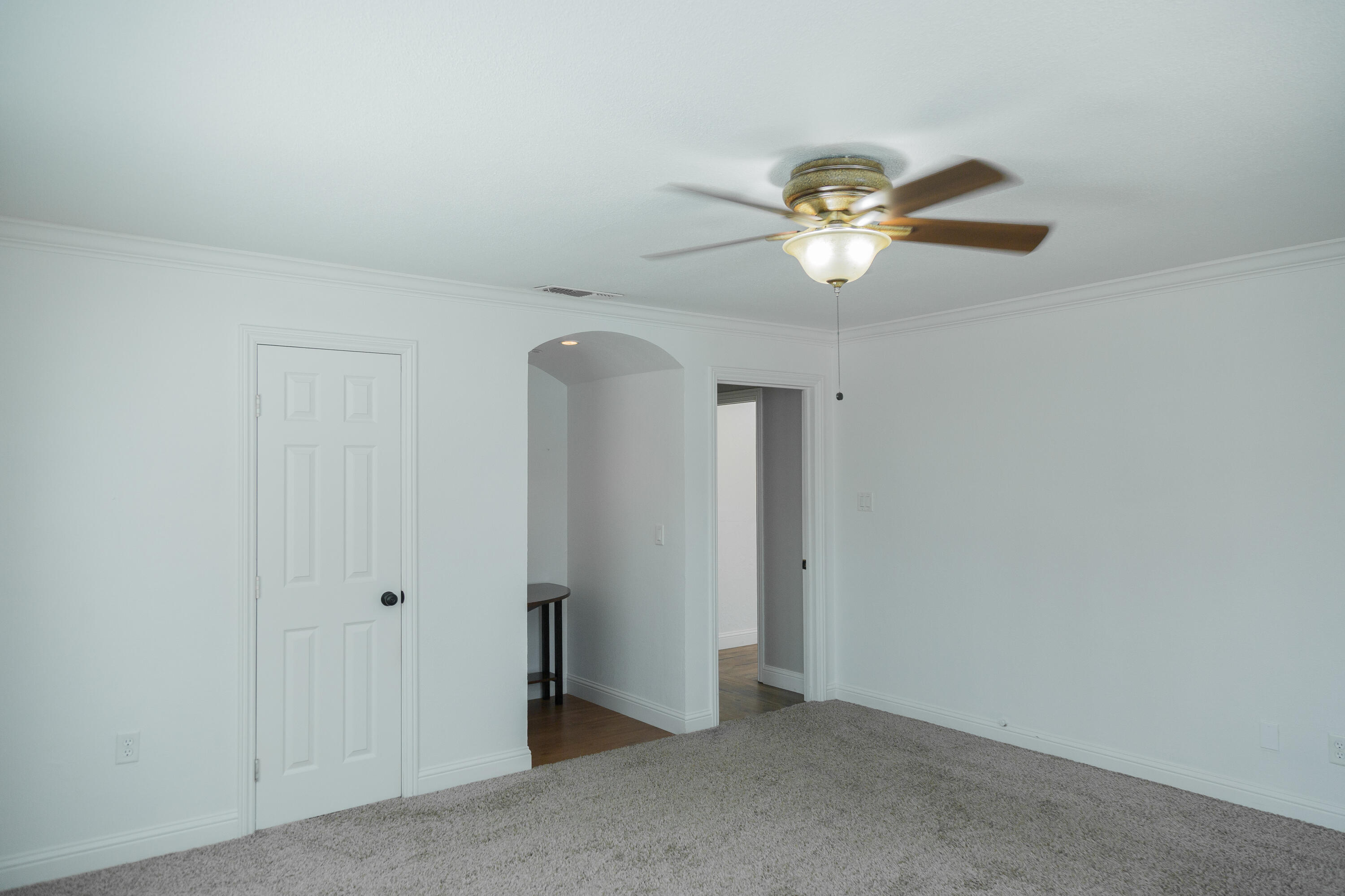 1308 West 24th Street Plainview, TX 79072 - Photo 58 of 85 a view of a chandelier fan and a carpet