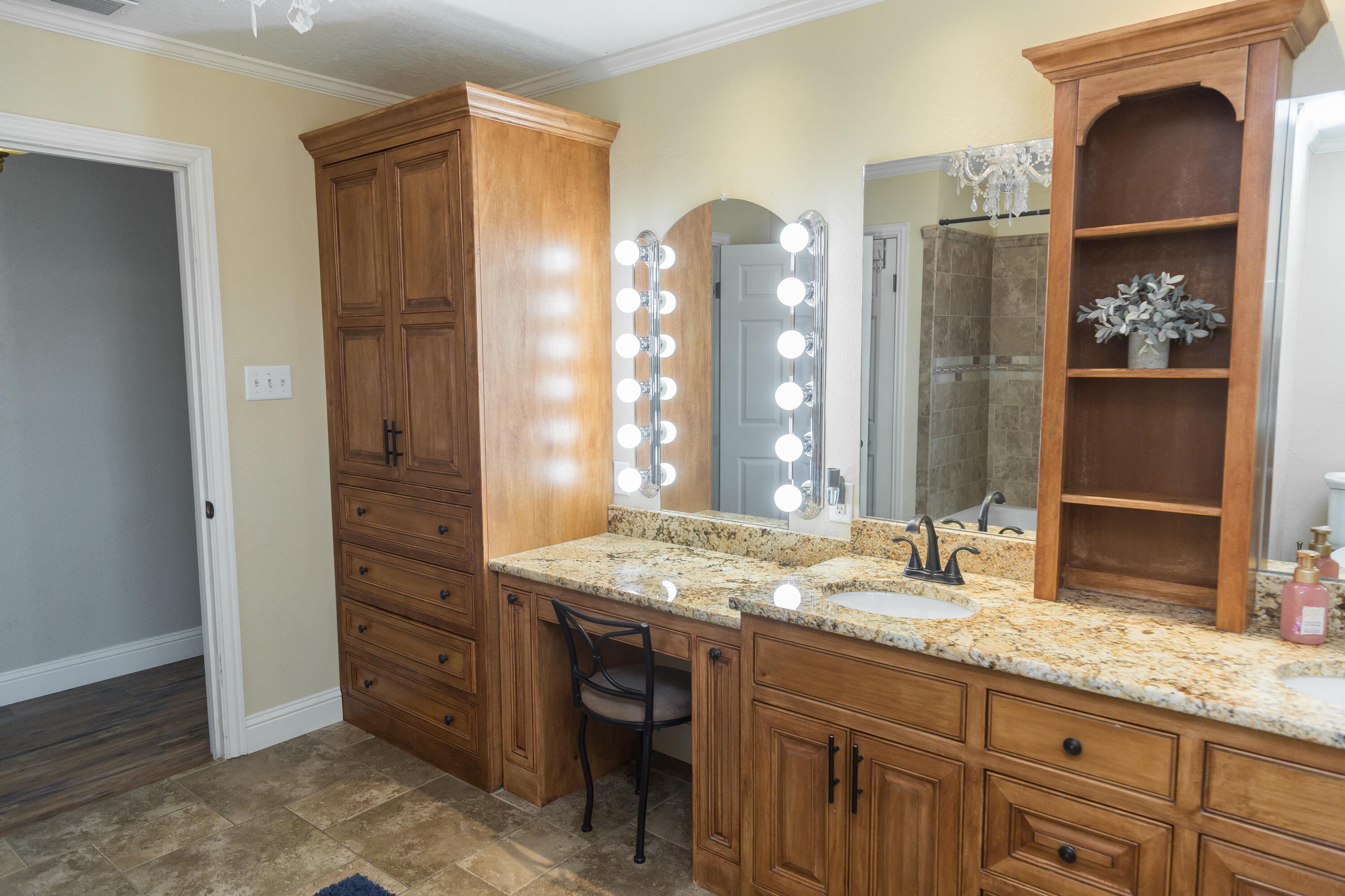 1308 West 24th Street Plainview, TX 79072 - Photo 61 of 85 a bathroom with a granite countertop sink and a mirror