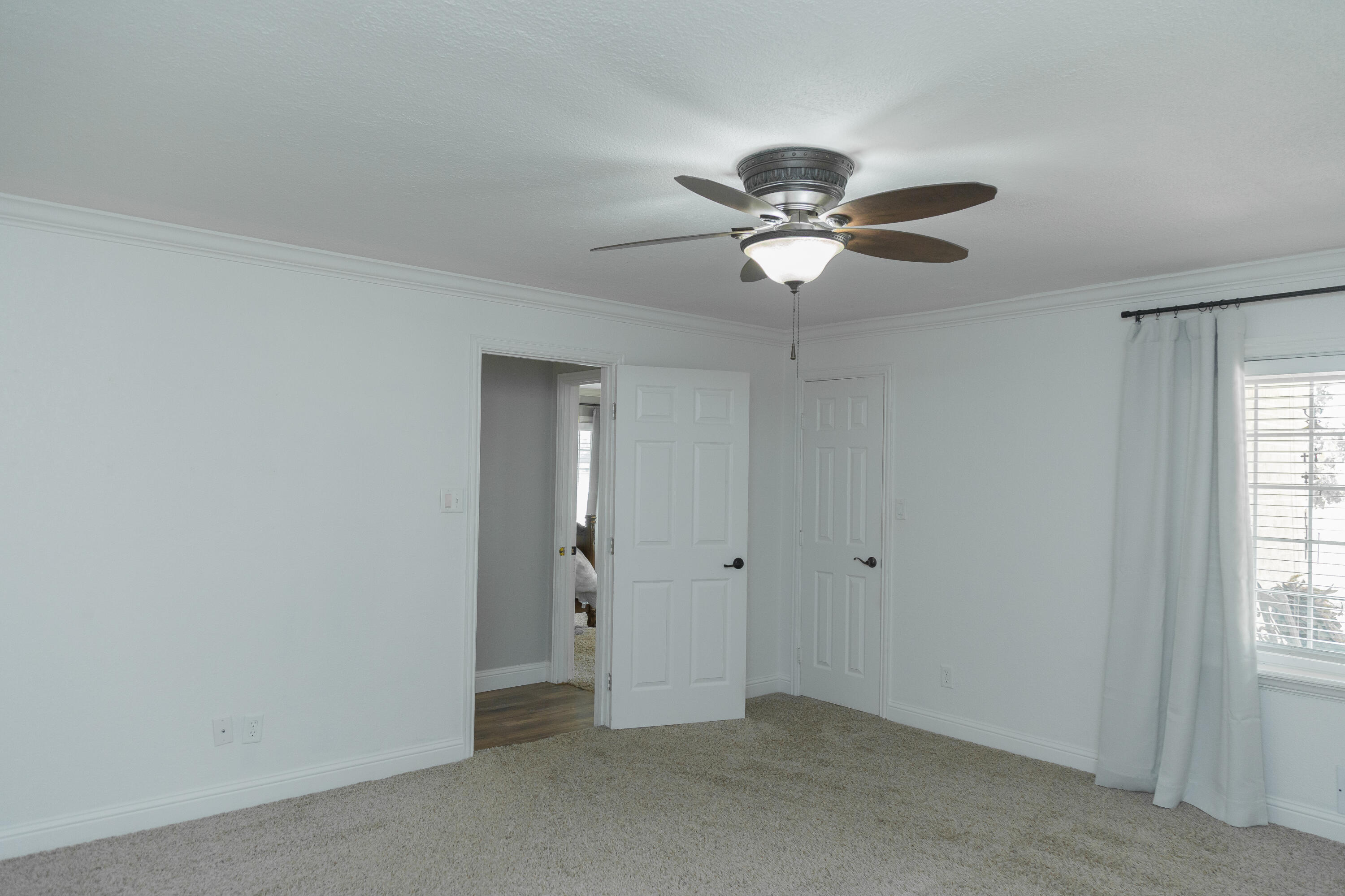 1308 West 24th Street Plainview, TX 79072 - Photo 69 of 85 a view of a chandelier fan in a room
