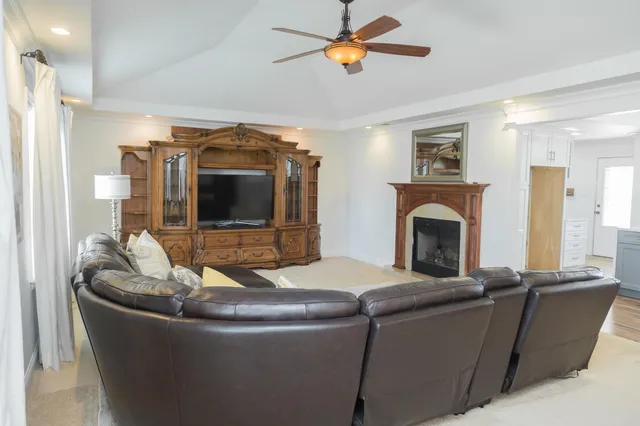 a view of kitchen with stainless steel appliances granite countertop a stove and a sink