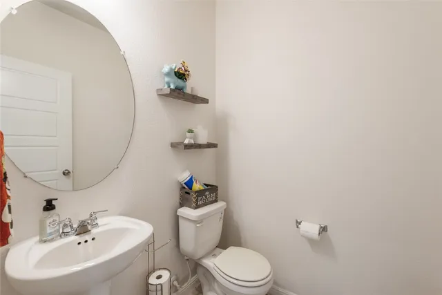 a kitchen with stainless steel appliances kitchen island granite countertop a table chairs and a refrigerator