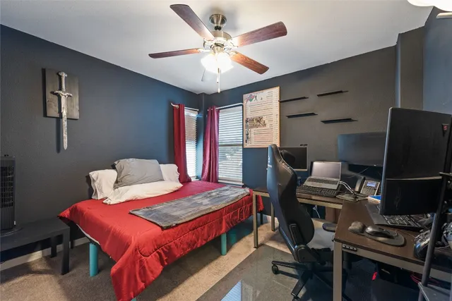 a bathroom with a double vanity sink a toilet and a mirror