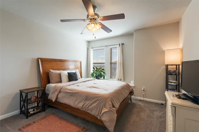 a bedroom with a bed and a table