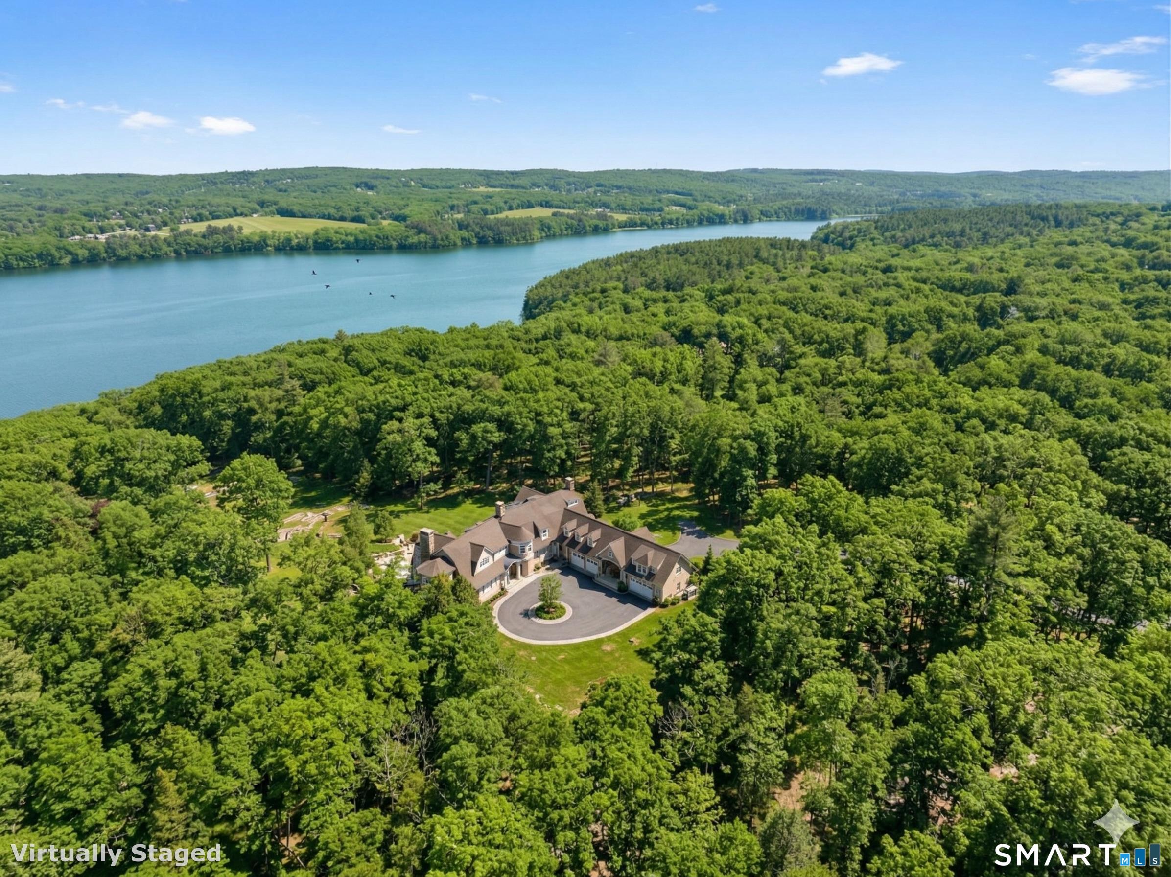 5 Viewpoint Lane Ellington, CT 06029 - Photo 1 of 40 a view of a lake with a yard