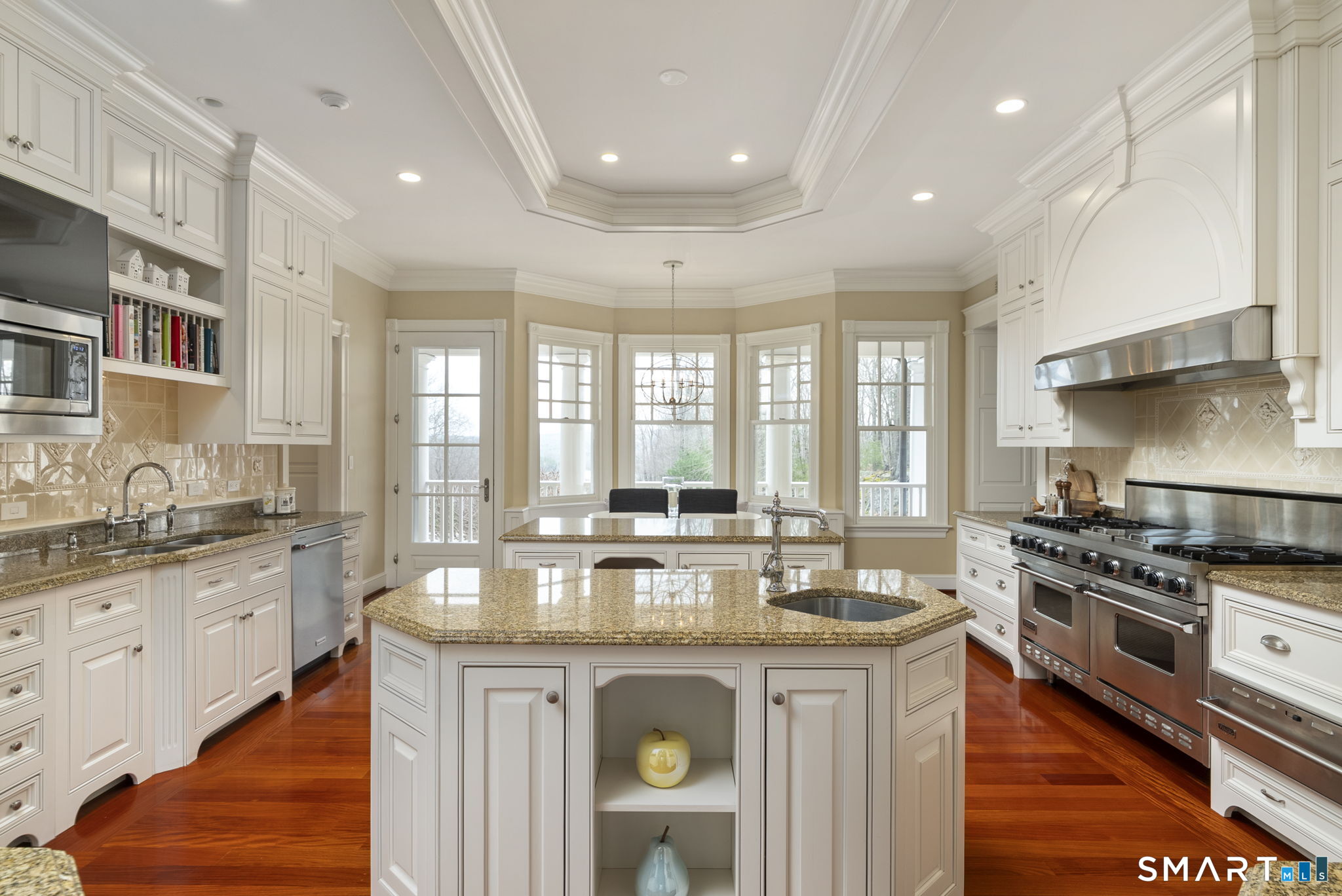 5 Viewpoint Lane Ellington, CT 06029 - Photo 16 of 40 a large kitchen with kitchen island granite countertop a stove and a sink
