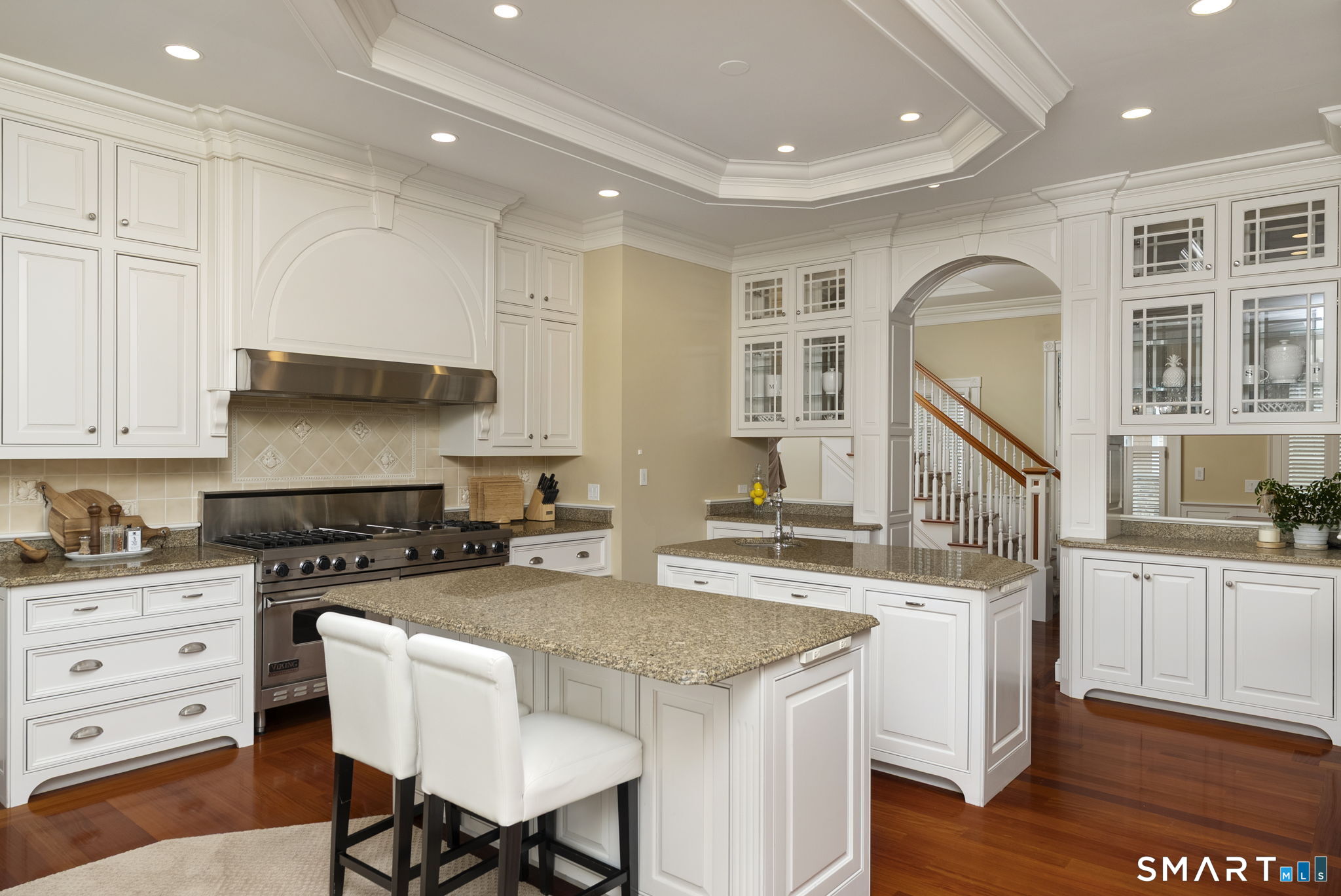 5 Viewpoint Lane Ellington, CT 06029 - Photo 17 of 40 a kitchen with a stove a sink a dining table and chairs