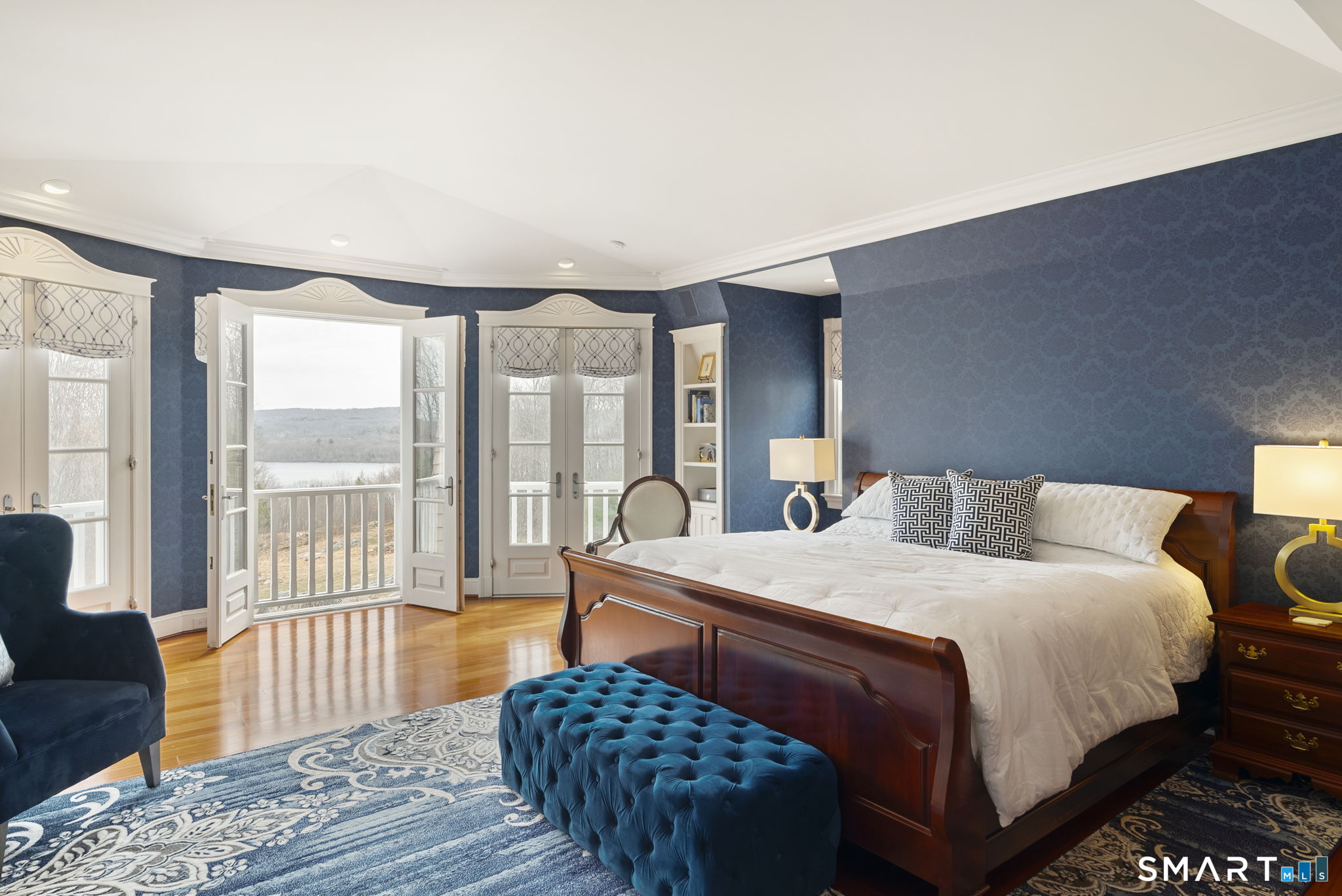 5 Viewpoint Lane Ellington, CT 06029 - Photo 22 of 40 a bedroom with a bed a couch and a large window