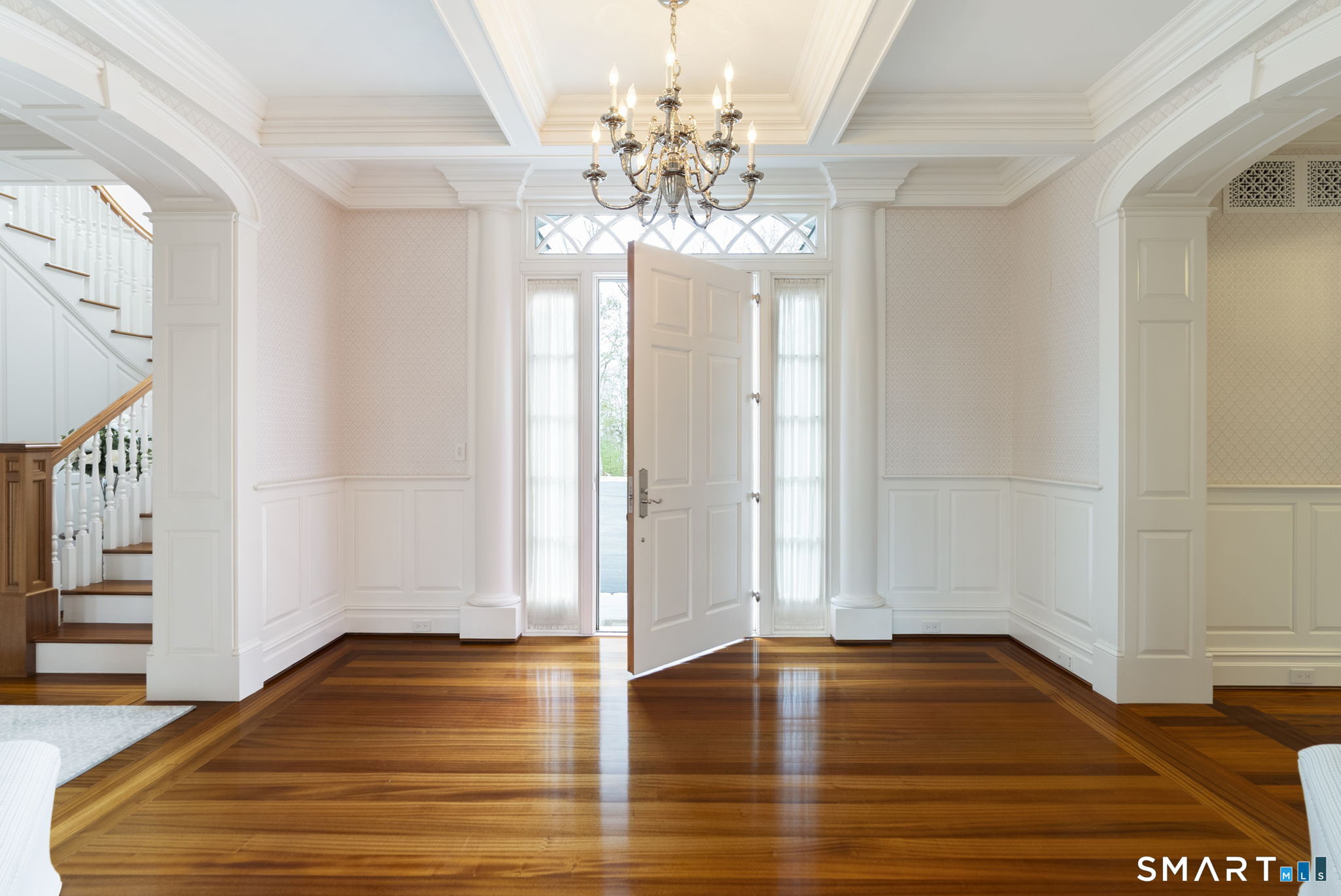 5 Viewpoint Lane Ellington, CT 06029 - Photo 4 of 40 a view of a room with wooden floor and chandelier