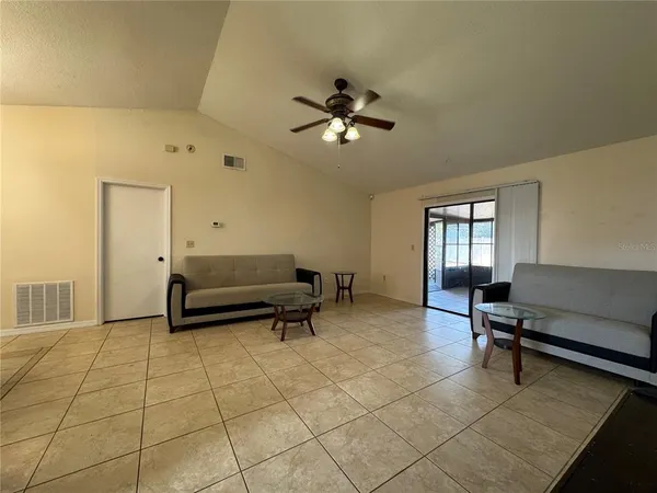 a living room with furniture and a window