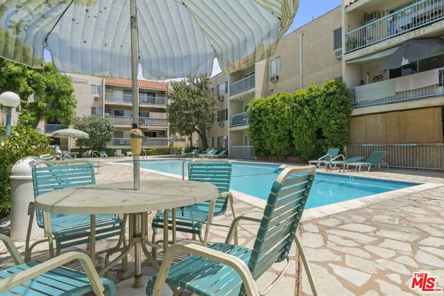 a view of a swimming pool with a lounge chairs