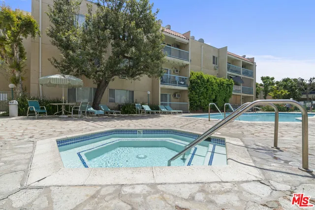 a view of a swimming pool with a lounge chairs