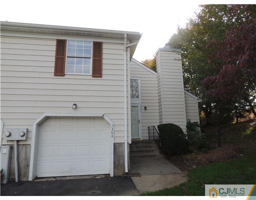 2304 Buckingham Circle Middletown, NJ 07748 - Photo 2 of 25 a view of a house with backyard and trees