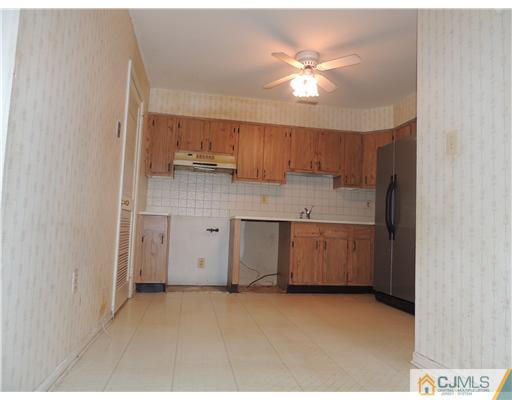 2304 Buckingham Circle Middletown, NJ 07748 - Photo 13 of 25 a kitchen with a sink cabinets and window