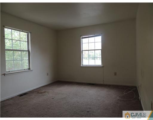 2304 Buckingham Circle Middletown, NJ 07748 - Photo 18 of 25 an empty room with a window