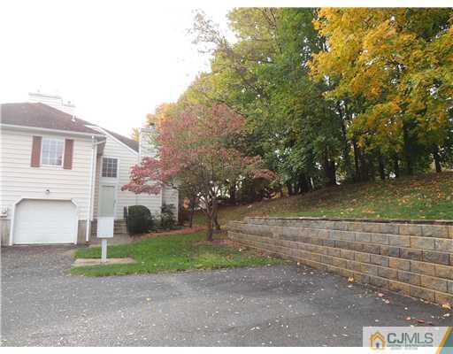 2304 Buckingham Circle Middletown, NJ 07748 - Photo 24 of 25 a view of a house with a yard