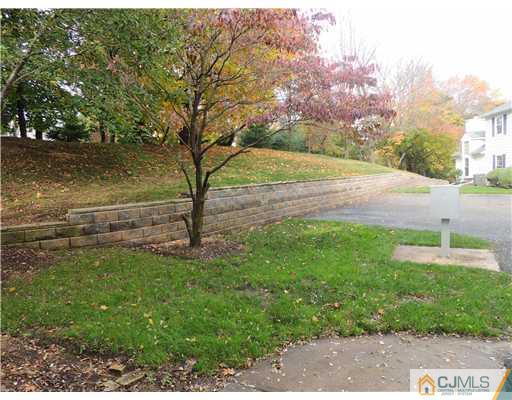 2304 Buckingham Circle Middletown, NJ 07748 - Photo 25 of 25 a backyard of a house with lots of green space