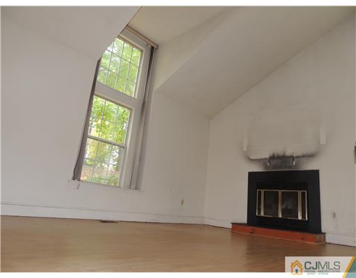 2304 Buckingham Circle Middletown, NJ 07748 - Photo 6 of 25 an empty room with windows