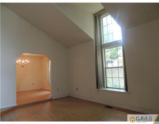 2304 Buckingham Circle Middletown, NJ 07748 - Photo 7 of 25 an empty room with windows