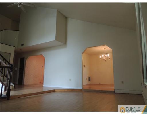 2304 Buckingham Circle Middletown, NJ 07748 - Photo 9 of 25 a view of a livingroom with wooden floor