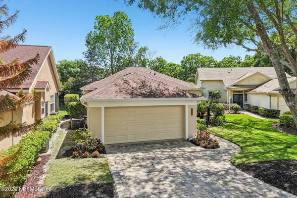 a kitchen with stainless steel appliances a refrigerator sink and microwave