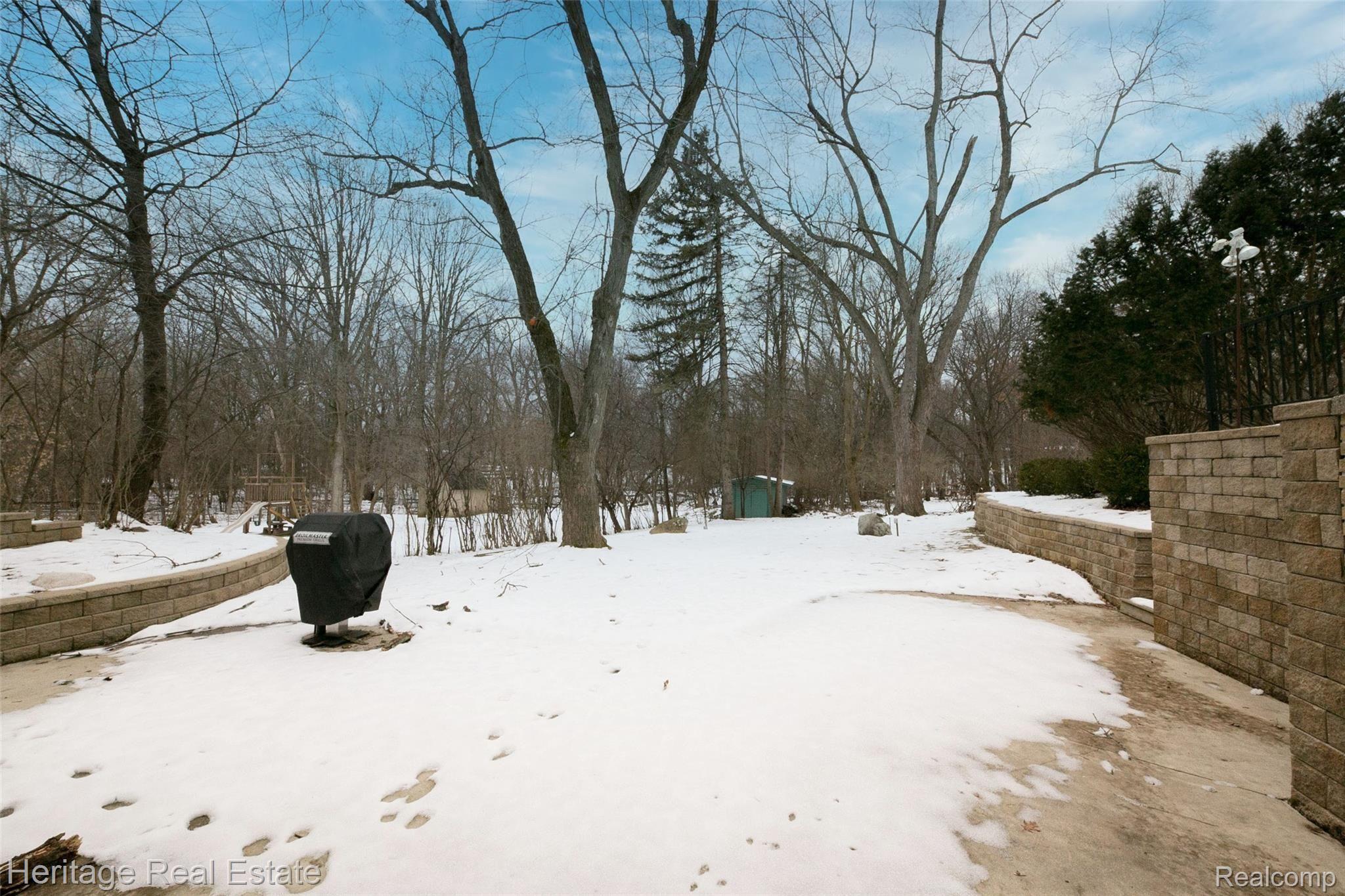 654 Old Perch Road Rochester, MI 48309 - Photo 51 of 61 Must-see large private backyard has huge patio space, beautiful hardscape, mature landscaping and backs to trees - a great place to enjoy nature, cook-outs and a game of catch