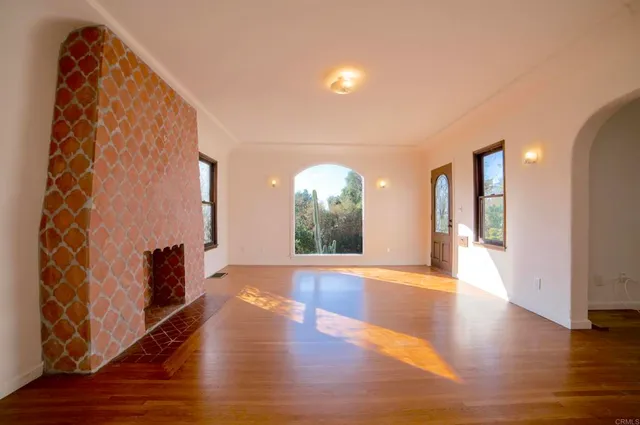 a view of an entryway with wooden floor