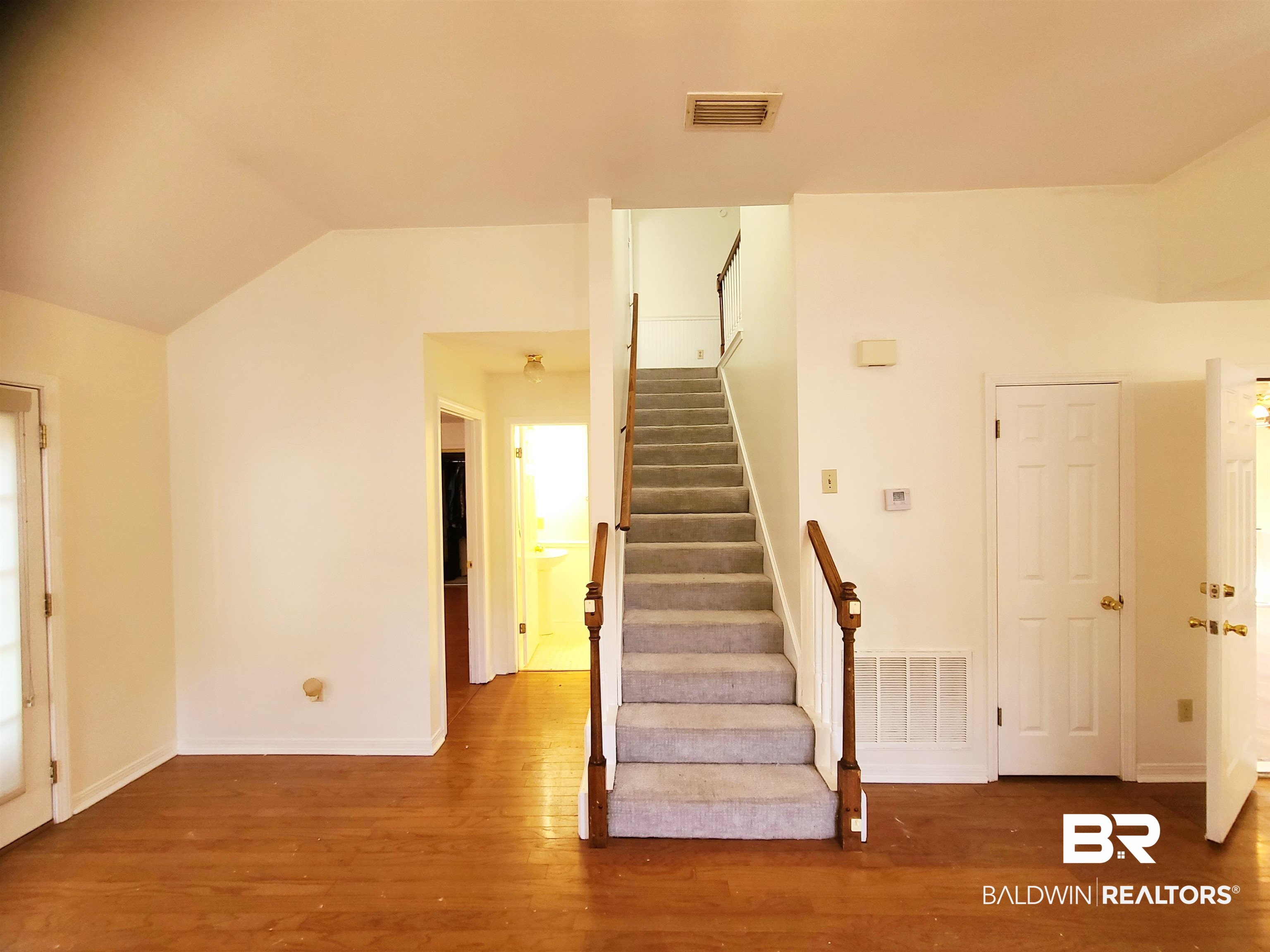 123 Melanie Loop Daphne, AL 36526 - Photo 12 of 17 Stairs featuring wood finished floors and baseboards