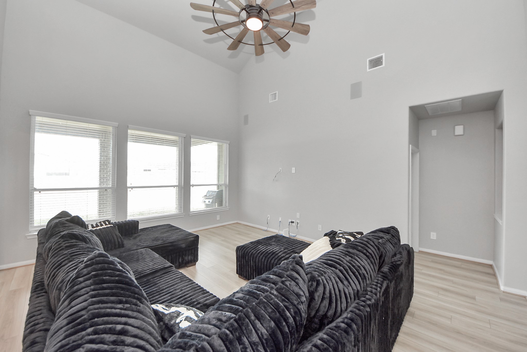 16735 Rockwall Street Conroe, TX 77303 - Photo 13 of 37 a bed sitting in a bedroom next to a window