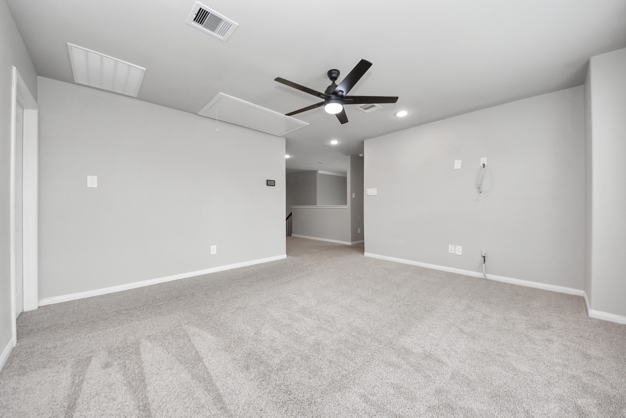 16735 Rockwall Street Conroe, TX 77303 - Photo 23 of 37 a view of an empty room with a ceiling fan