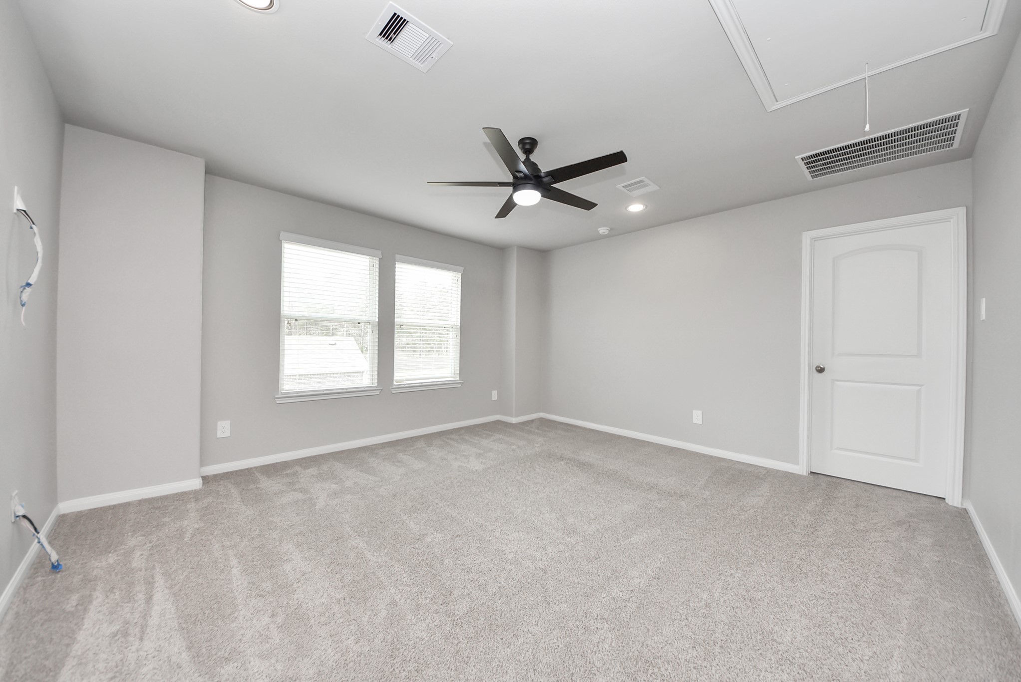 16735 Rockwall Street Conroe, TX 77303 - Photo 25 of 37 Each bedroom provides ample room for furnishings, comfortable living, and generous closet space, making them ideal for family members, guests, or even a home office or hobby room.