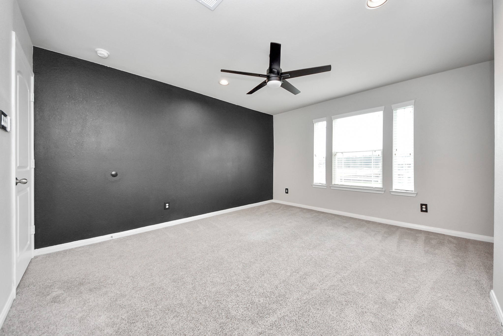 16735 Rockwall Street Conroe, TX 77303 - Photo 27 of 37 Each bedroom provides ample room for furnishings, comfortable living, and generous closet space, making them ideal for family members, guests, or even a home office or hobby room.