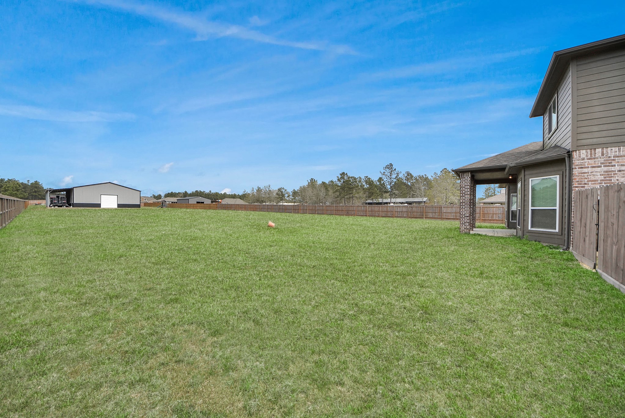 16735 Rockwall Street Conroe, TX 77303 - Photo 32 of 37 The generous lot size creates a sense of seclusion while still allowing plenty of space for recreation, entertaining, or future improvements.